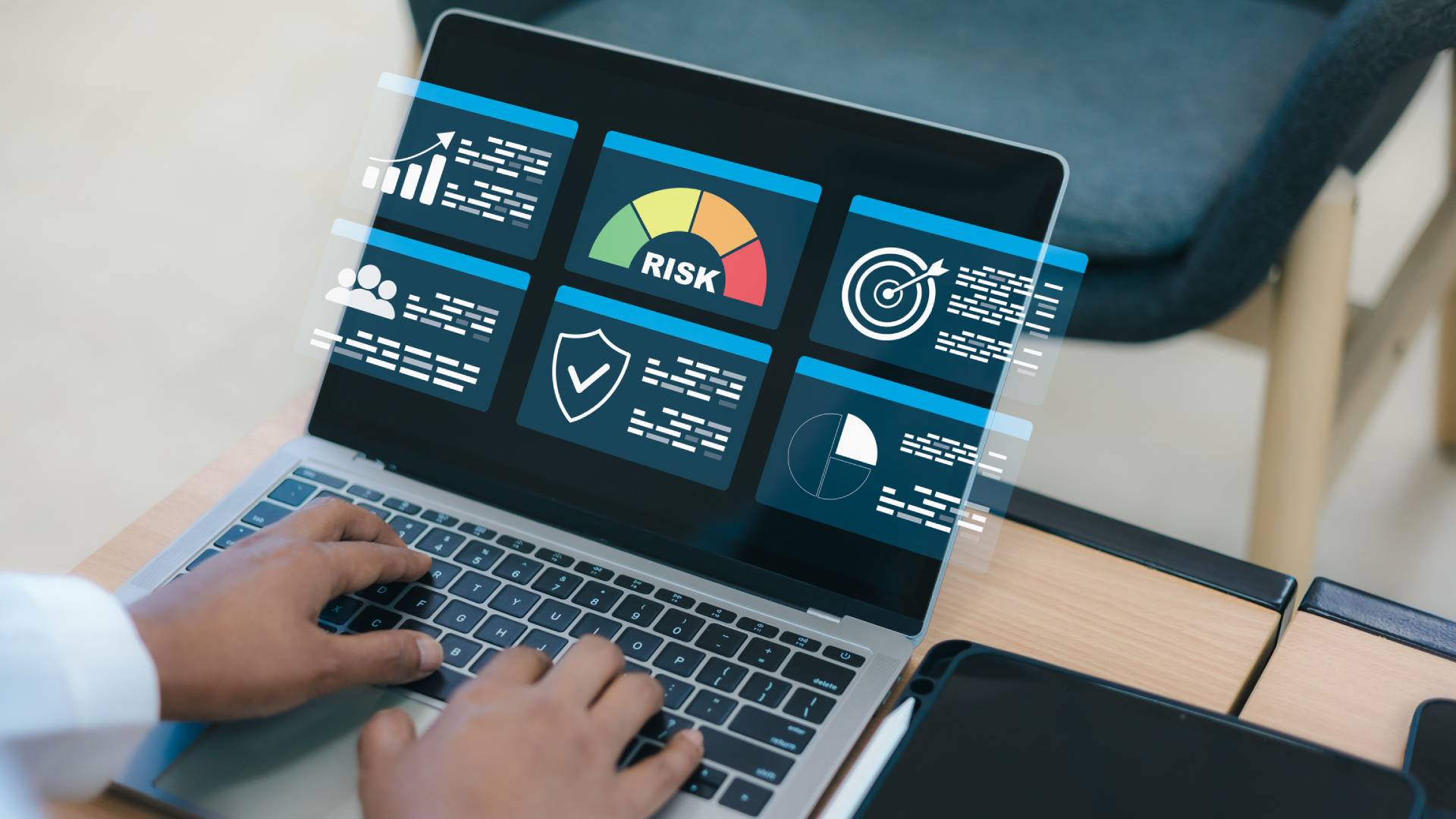Person analyzing risk data on laptop screen.