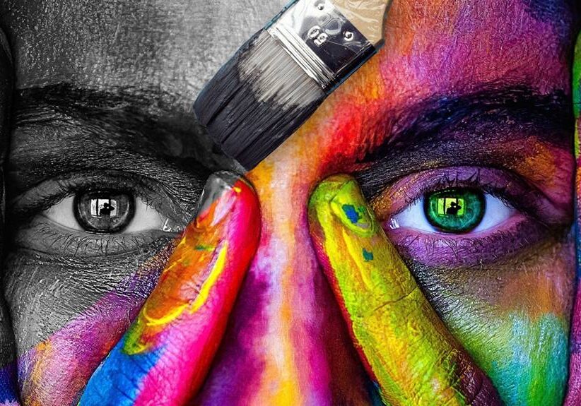 Close Up Of Woman's Face Covered In Dripping Paint